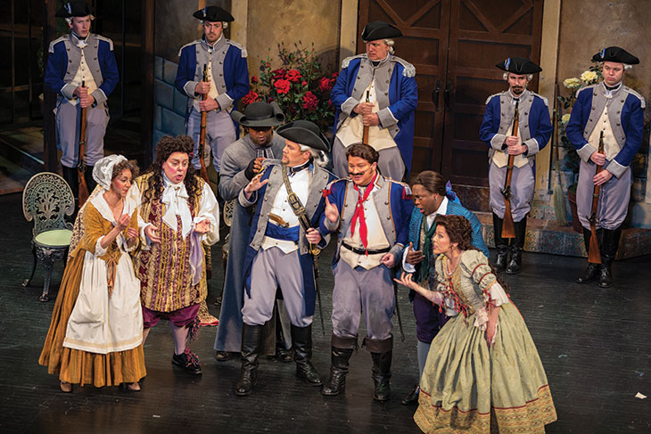Cast members on stage in costume